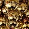 Reflecting Balls Above A Kiosk In A Mall