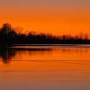 Sun's Glow On Wolf Lake